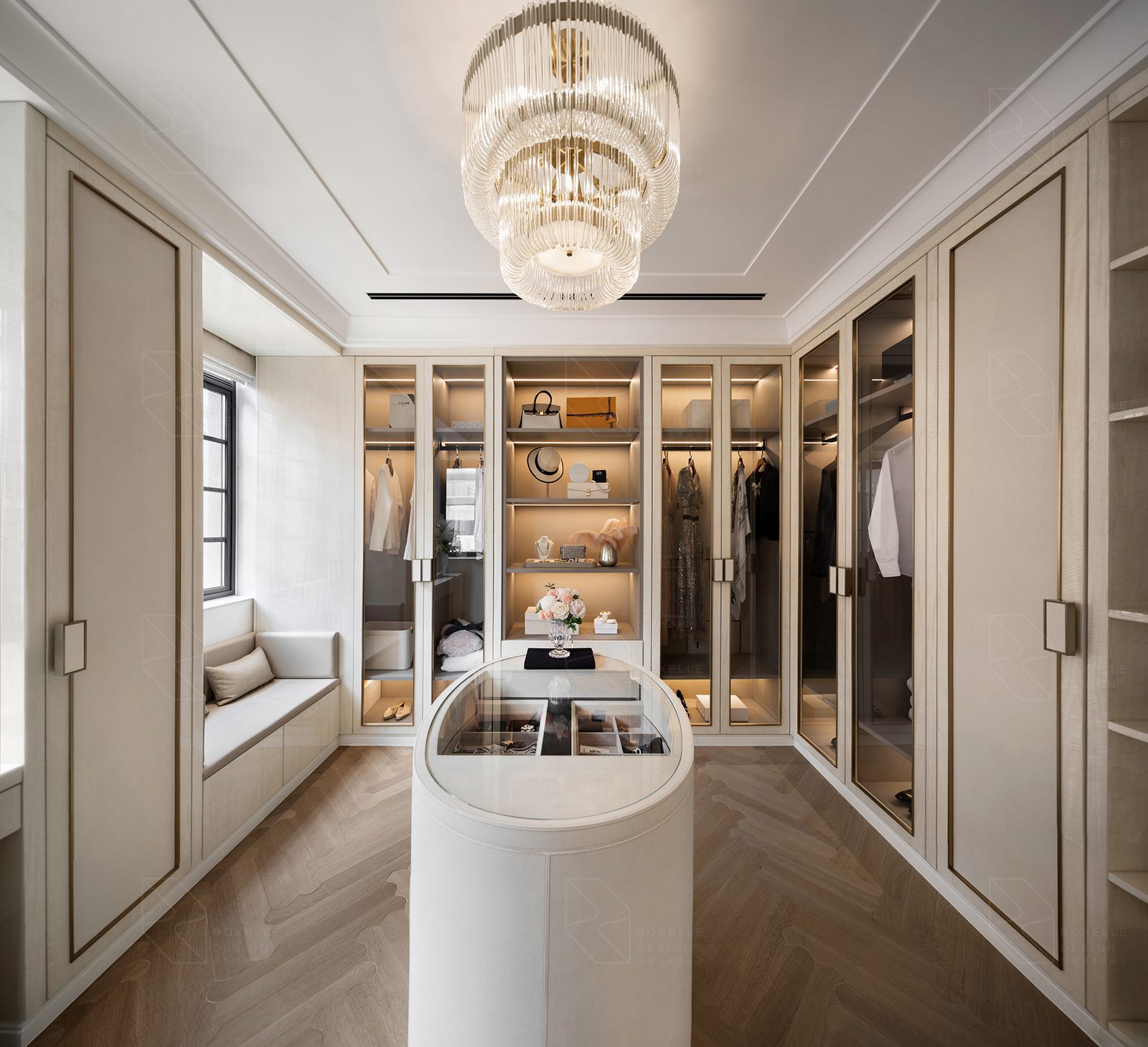 Dressing room with island and glazed cabinetry